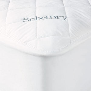 Princess Mattress Pad covering bed showing corner with blue SobelDry logo